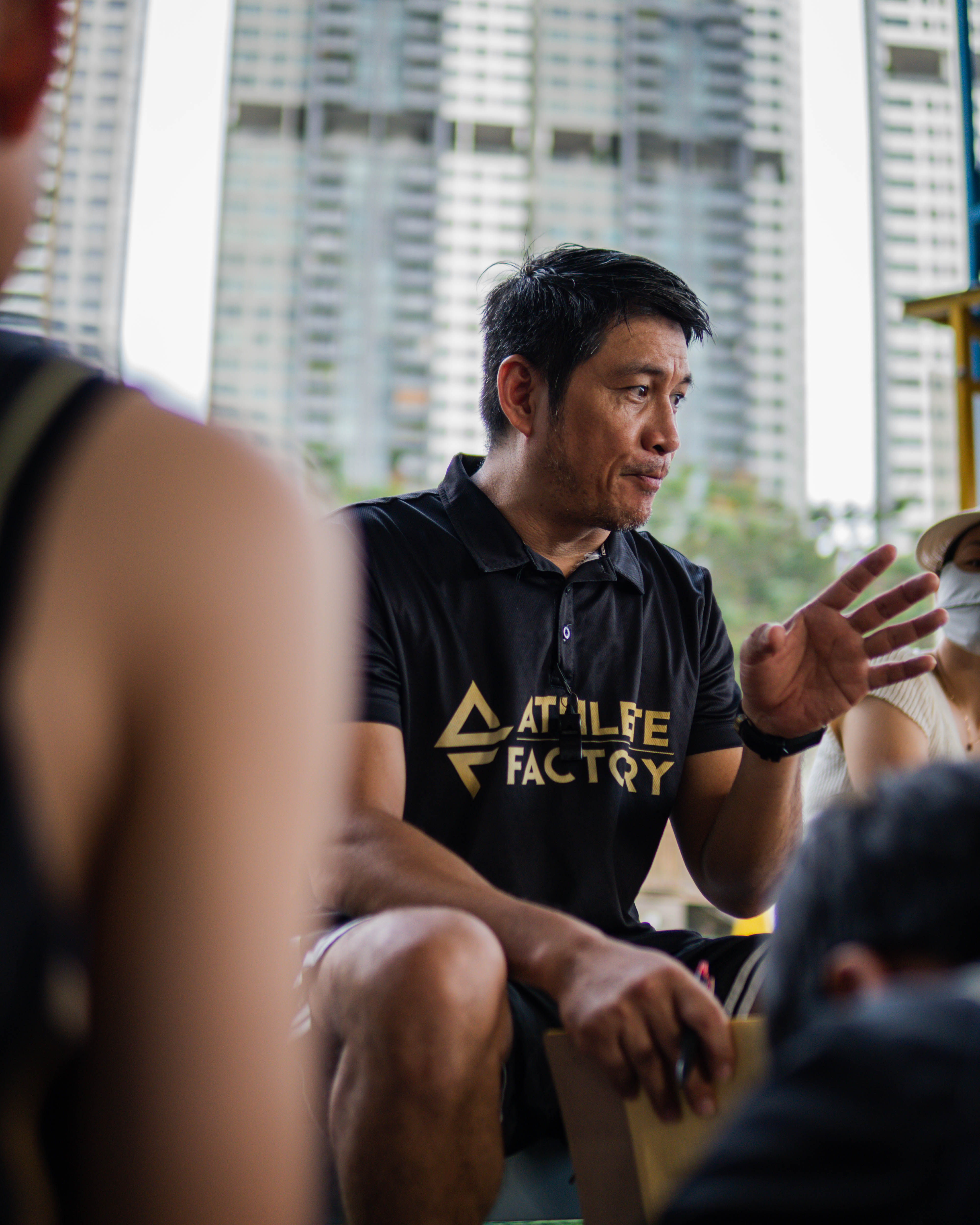 Coach briefing athletes on court strategy